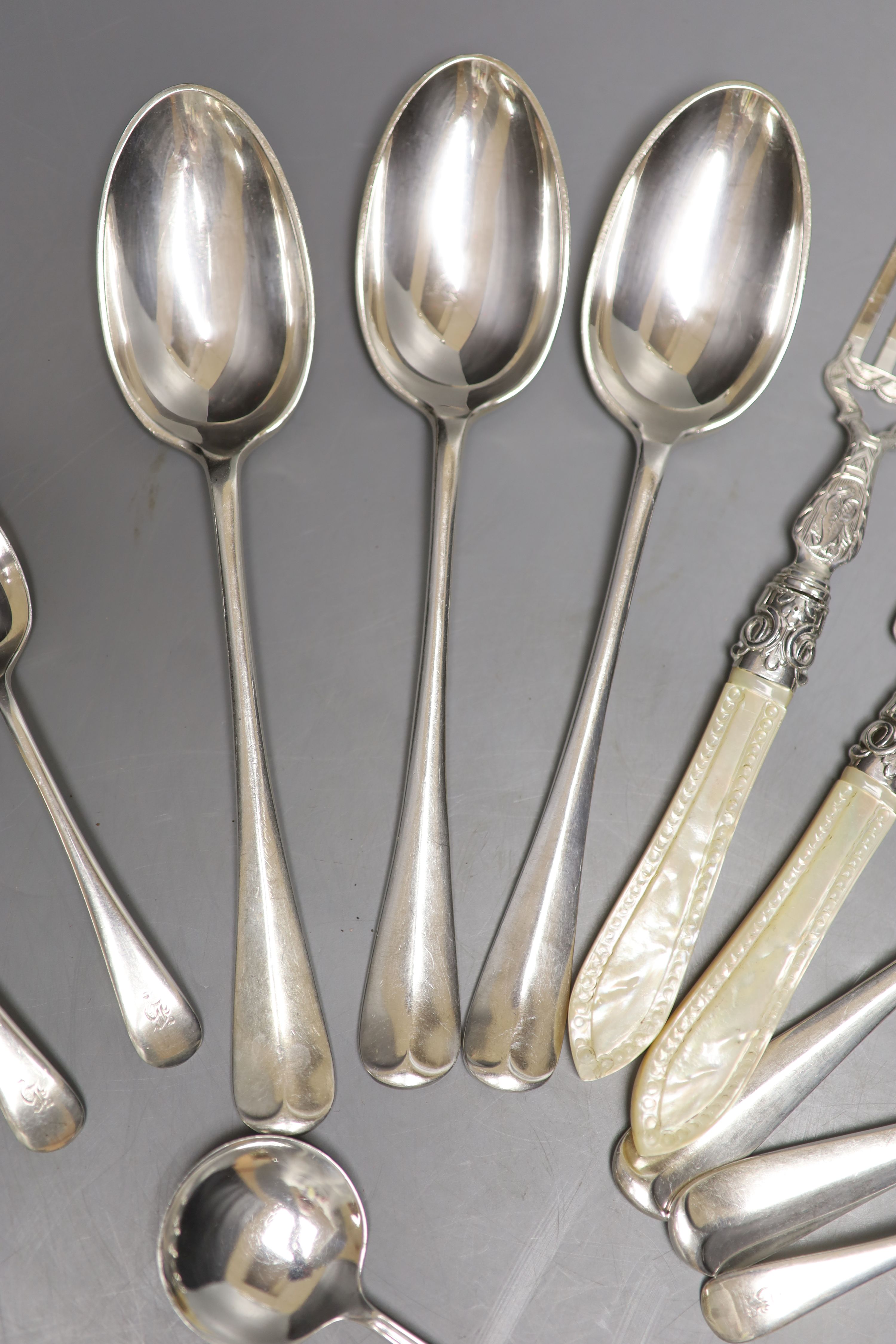 A Victorian mother of pearl handled silver knife and fork, George Unite, Birmingham, 1868, caddy spoon. etc.